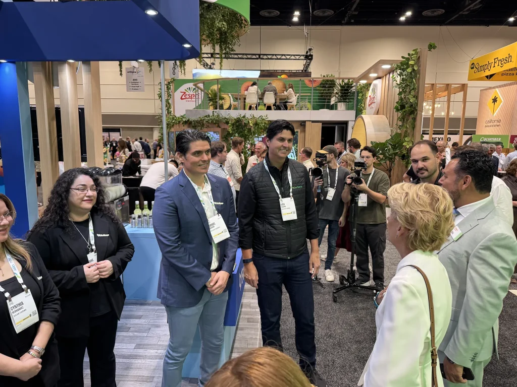 Visitors at the SiCar Farms booth during IFPA 2026
